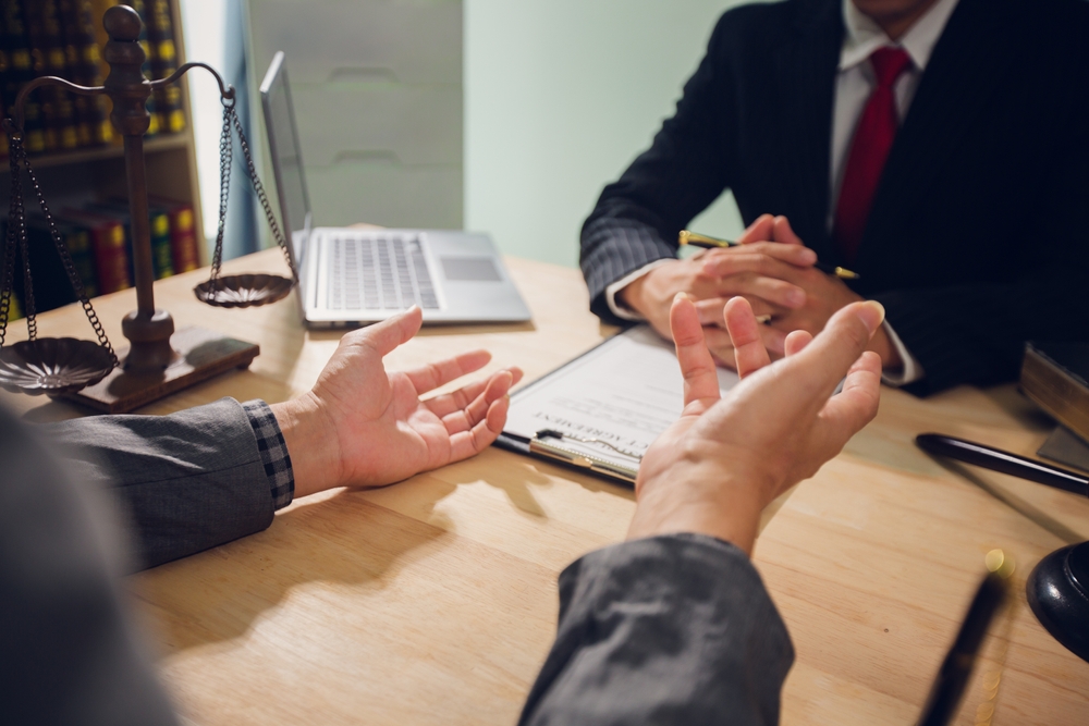 Businessmen consult with lawyers, submit additional documents, and pay for lawyers' services. After reaching an agreement and signing the contract, the two shake hands. Concept, Justice, and Lawyers