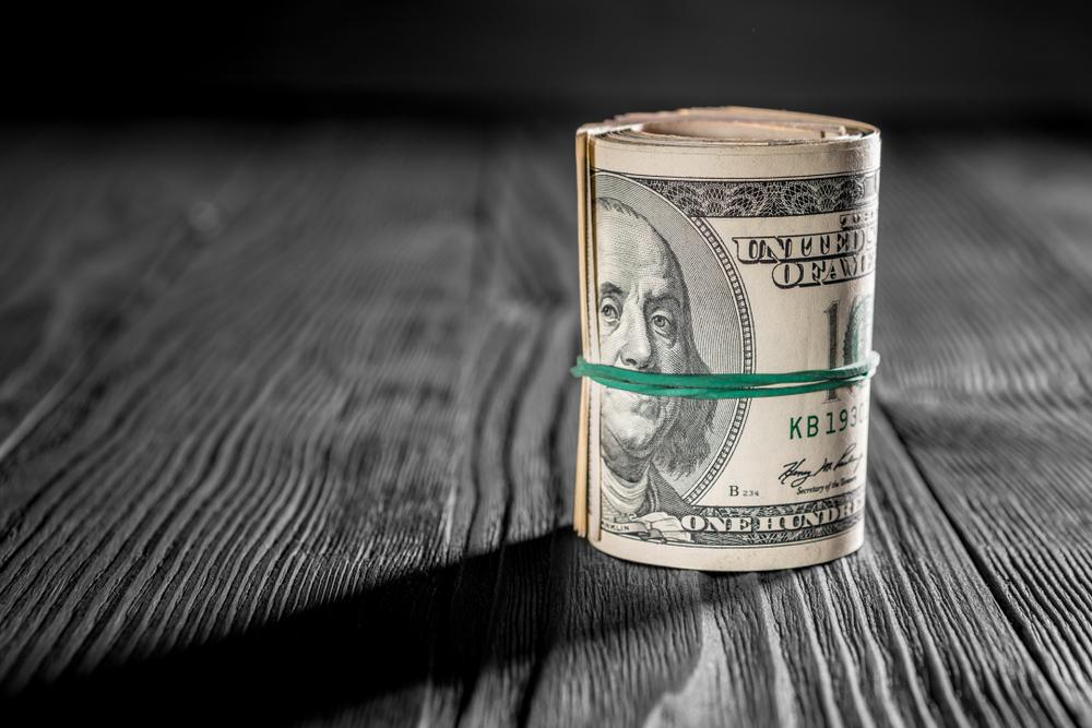 money isolated on a wooden background