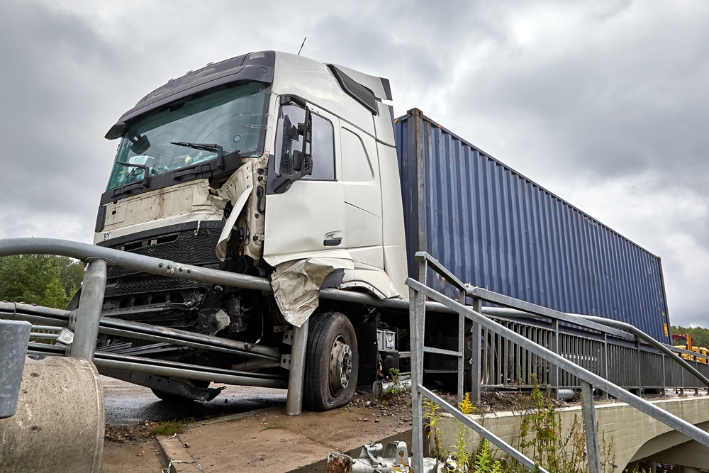 Tinuzi, Latvia: car accident on a road, truck after a collision with a road barrier, transportation background