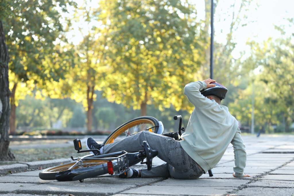 Cyclist injured due to road negligence and poor maintenance in Midvale City.