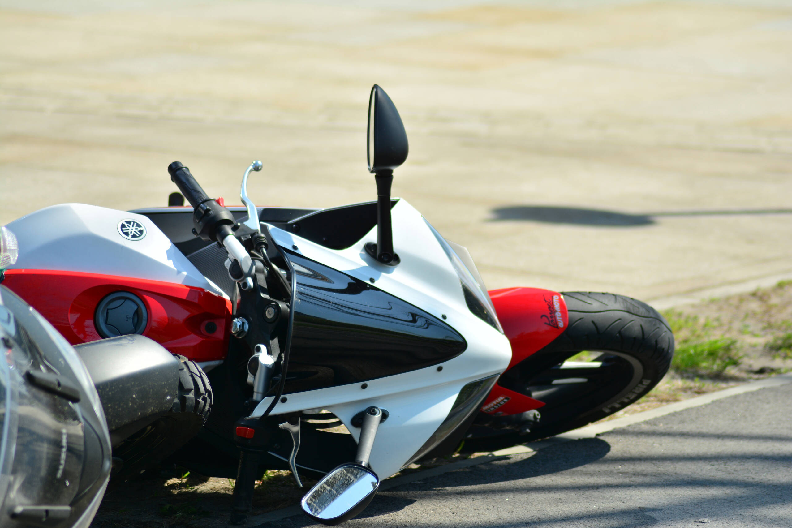 Crashed motorcycle on a Salt Lake Valley highway following a high-speed ejection.