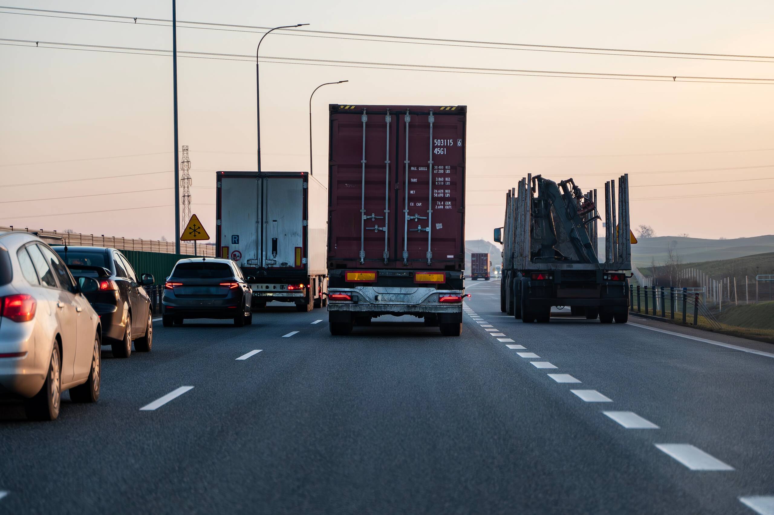 Logging truck without cargo traveling on a highway near Idaho Falls.