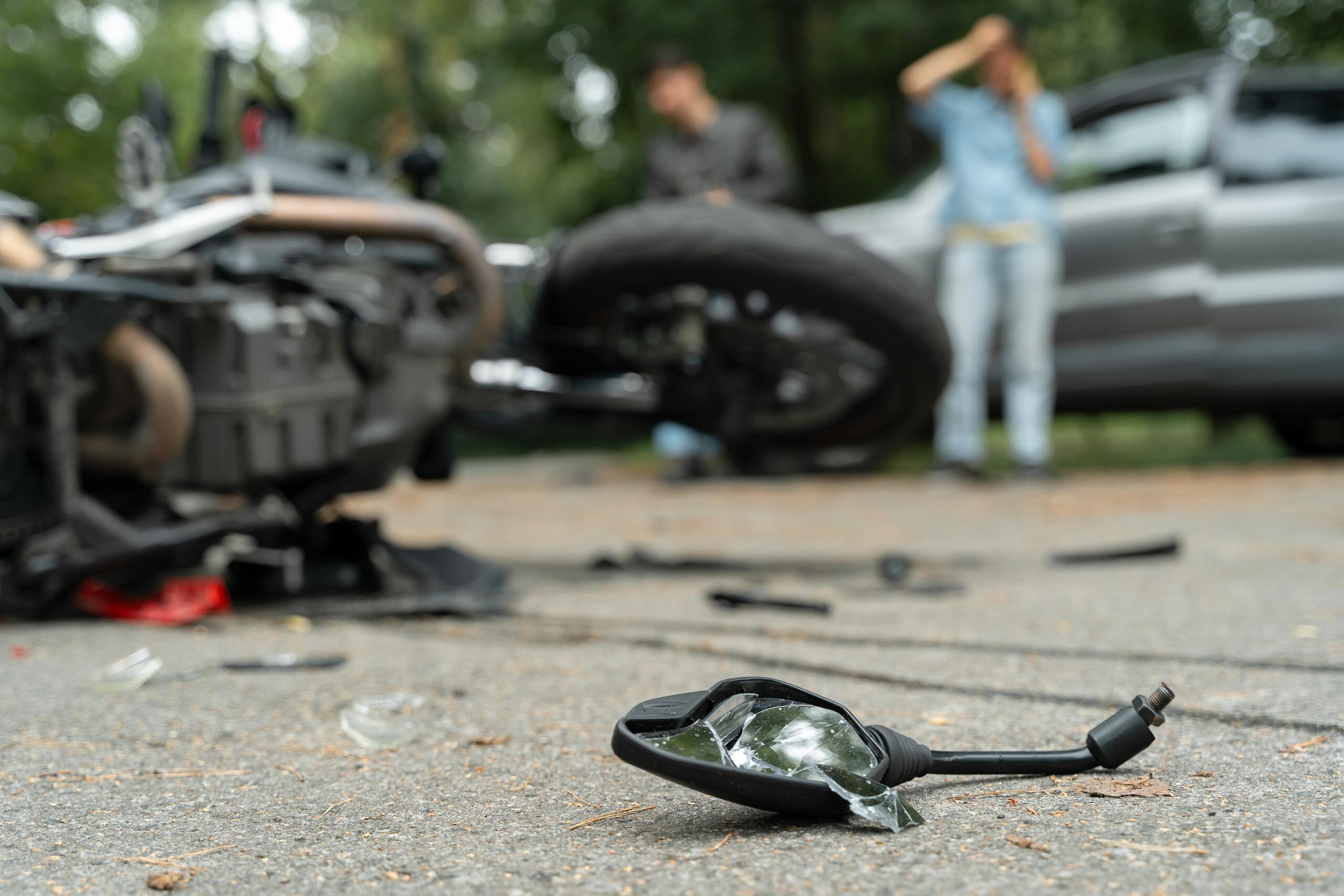 Broken motorcycle mirror following a left-turn intersection accident in Idaho Falls.