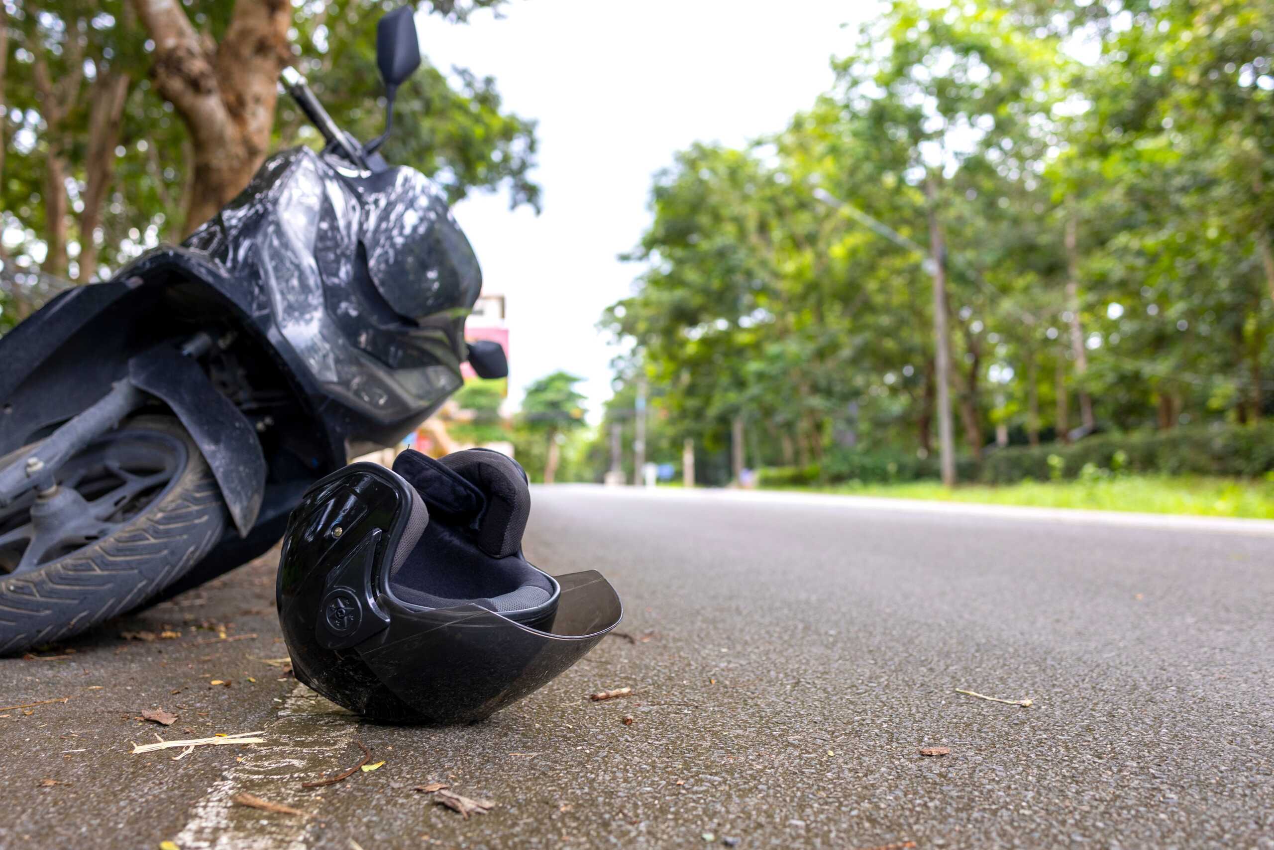 Black motorcycle helmet on the road following an accident in Idaho Falls.