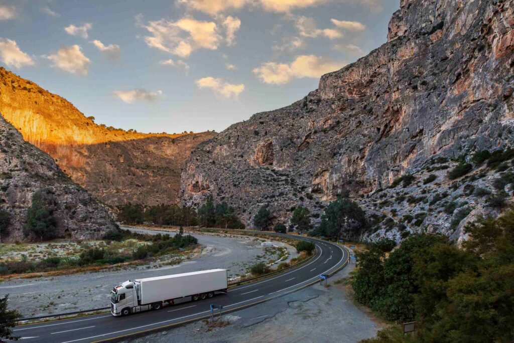 Semi-truck navigating steep grades in Weber Canyon used to establish truck accident liability in Ogden.