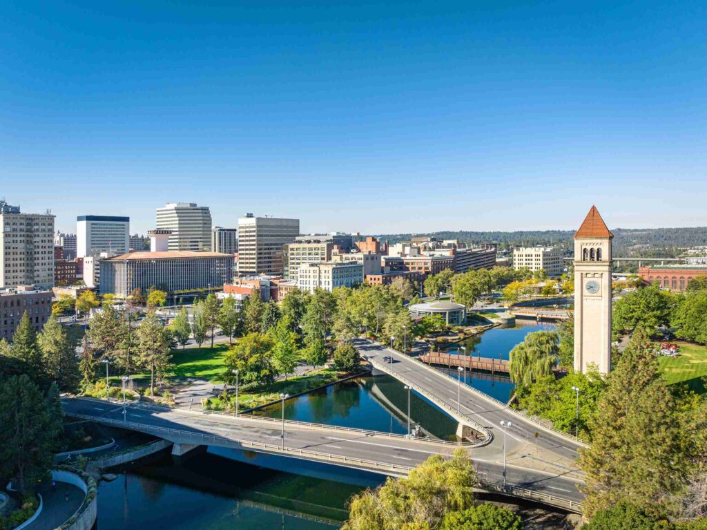 An aerial view of Riverfront Park and the Spokane skyline highlights the service area for Spokane Premises Liability Lawyers.